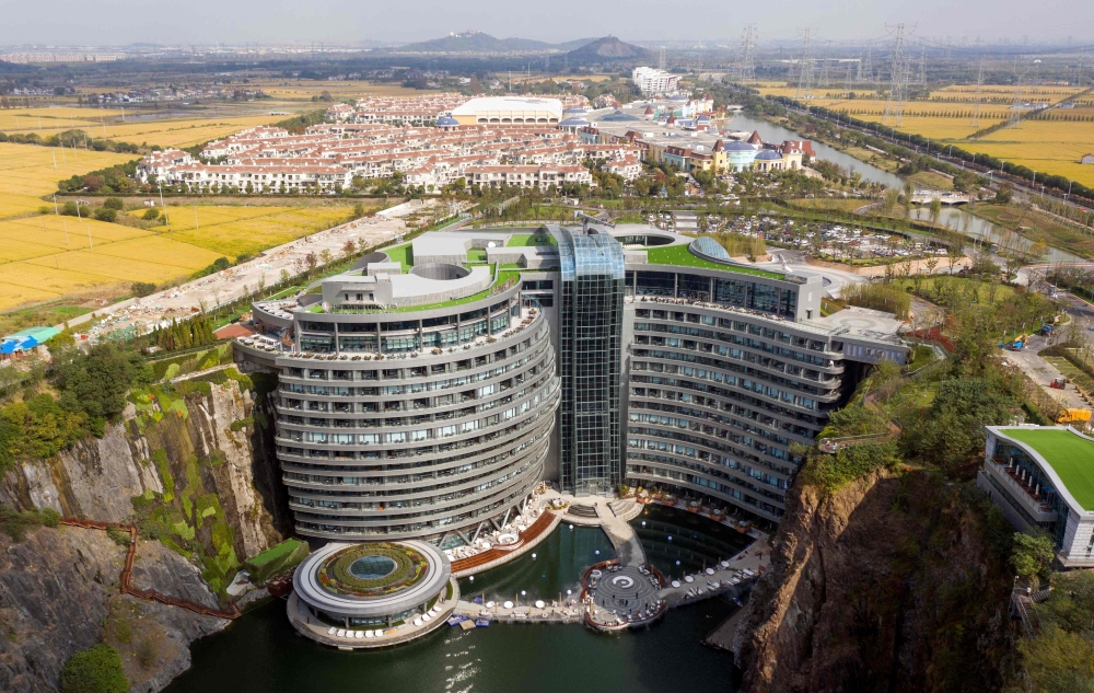 This aerial picture taken on November 13, 2018 shows the InterContinental Shanghai Wonderland, built inside a formerly abandoned quarry, about 32 kms (20 miles) southwest of Shanghai. / AFP / Johannes EISELE