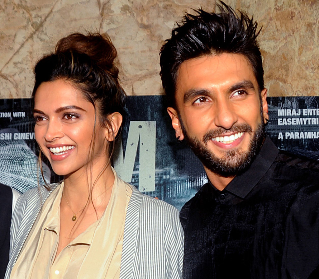 This file photo taken on July 21, 2016 shows Indian Bollywood actress Deepika Padukone (L) and actor Ranveer Singh (R) attending a screening of the Hindi film 