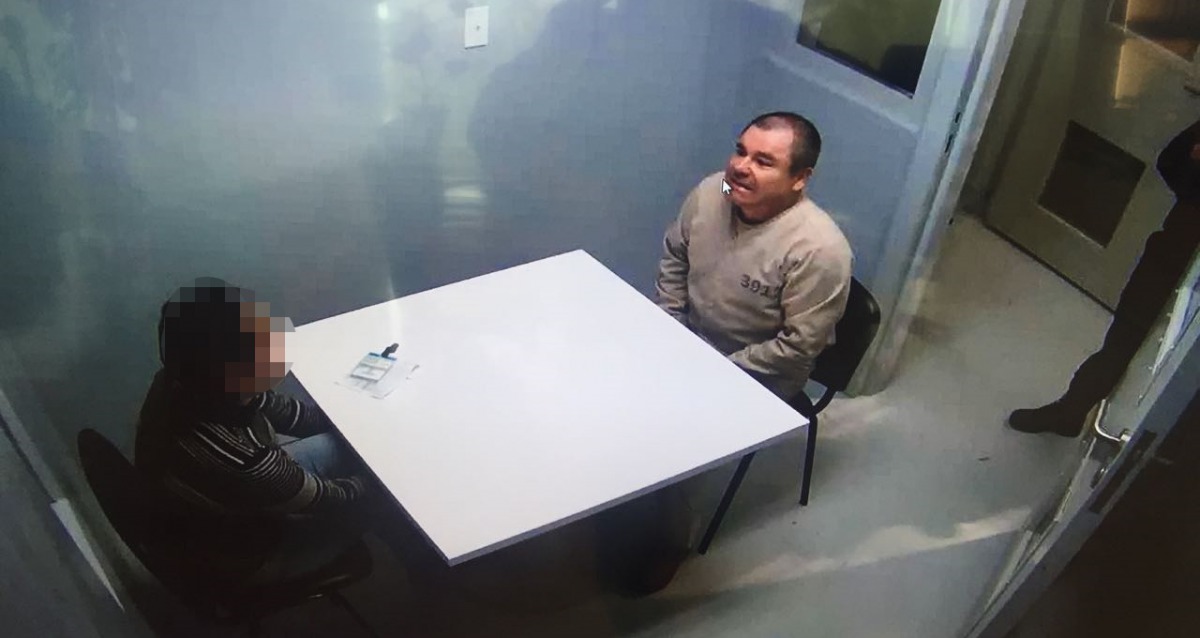 Handout picture released by the Mexican Interior Ministry on January 20, 2017 shows Joaquin Guzman Loera aka El Chapo Guzman sitting in a chair as he is extradited to the US in an unknowen location. AFP