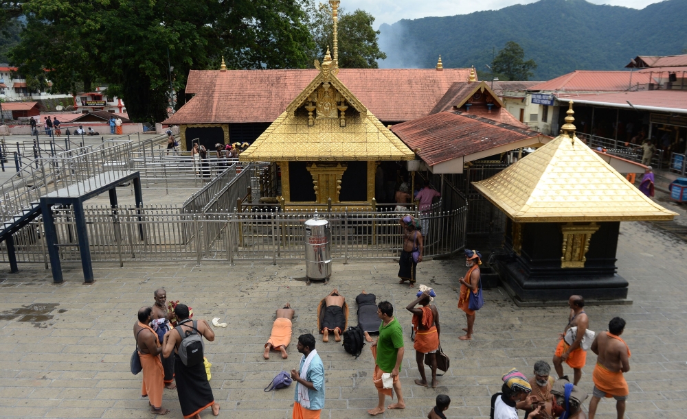 In this file photo taken on October 18, 2018 Indian Hindu devotees are pictured at the Sabarimala hilltop temple in the southern state of Kerala. AFP / Arun Sankar 