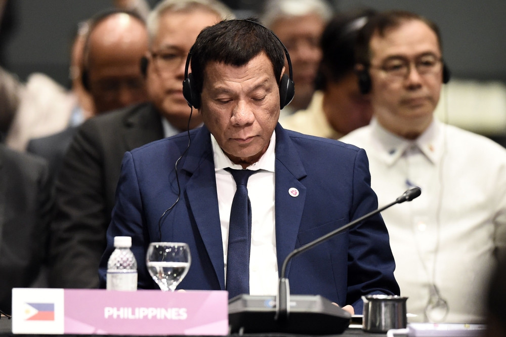 Philippine President Rodrigo Duterte attends the ASEAN-Plus Three (APT) summit on the sidelines of the 33rd Association of Southeast Asian Nations (ASEAN) summit in Singapore on November 15, 2018. AFP / Lillian Suwanrumpha 