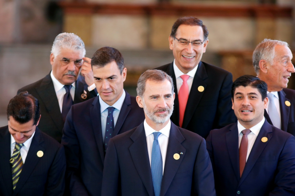 Spain's King Felipe waits for a group photo during the XXVI Ibero-American Summit in Antigua Guatemala, Guatemala, November 16, 2018. Reuters/Jose Cabezas 