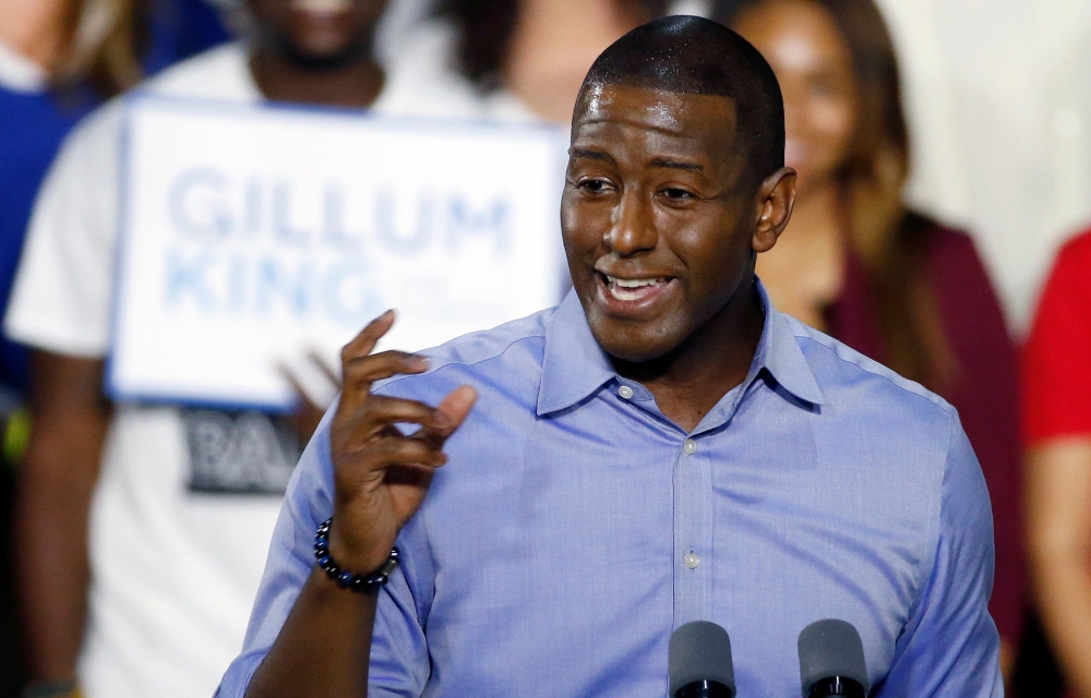 (FILES) In this file photo taken on November 2, 2018 Florida Democratic gubernatorial nominee Andrew Gillum addresses the crowd as he, former US President Barack Obama, and Senator Bill Nelson (D-FL) stump for votes at a rally in Miami, Florida. AFP / RHO