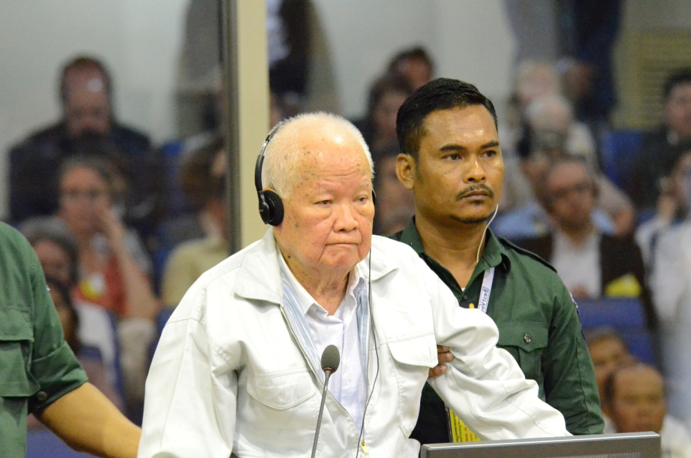 Former Khmer Rouge head of state Khieu Samphan stands inside a dock at the courtroom of the Extraordinary Chambers in the Courts of Cambodia (ECCC) as he awaits a verdict, on the outskirts of Phnom Penh, Cambodia, November 16, 2018.