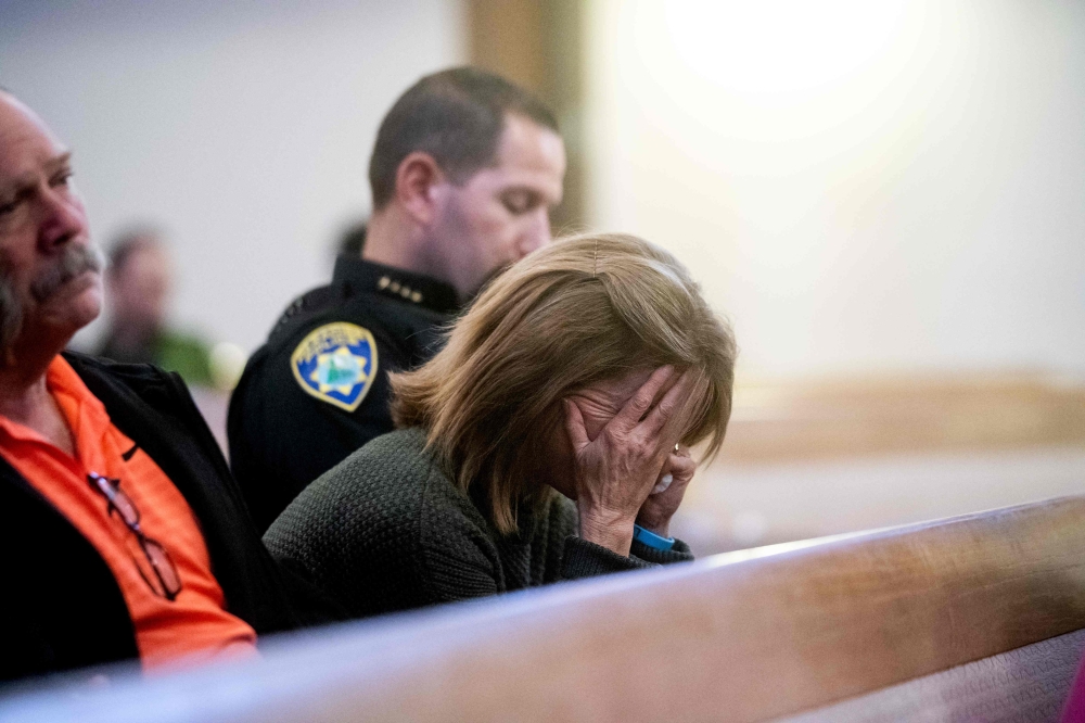 Paradise Town Manager Lauren Gill cries during a vigil for Camp Fire victims on Sunday, November 18, 2018, at the First Christian Church of Chico in Chico, California. AFP / POOL / Noah Berger