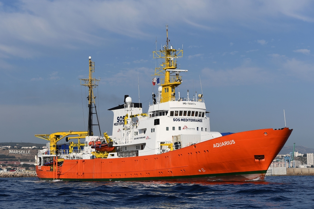 FILE PHOTO: In this file photo taken on August 1, 2018 the rescue ship Aquarius, chartered by French aid group SOS Mediterranee and Doctors Without Borders (MSF), leaves the harbour of Marseille, southeastern France, after having been docked for a month f
