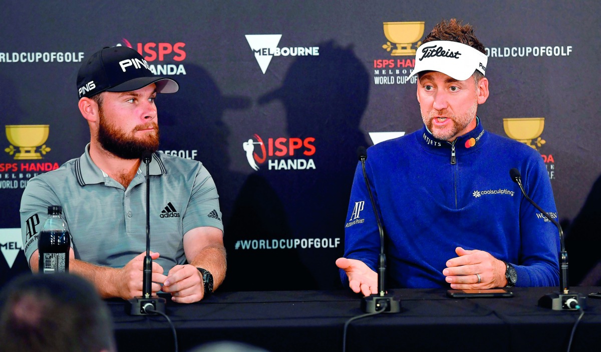Team England's Tyrrell Hatton (L) and Ian Poulter speak during a press conference after a practice round at the World Cup of Golf in Melbourne on November 21, 2018. AFP / William West 