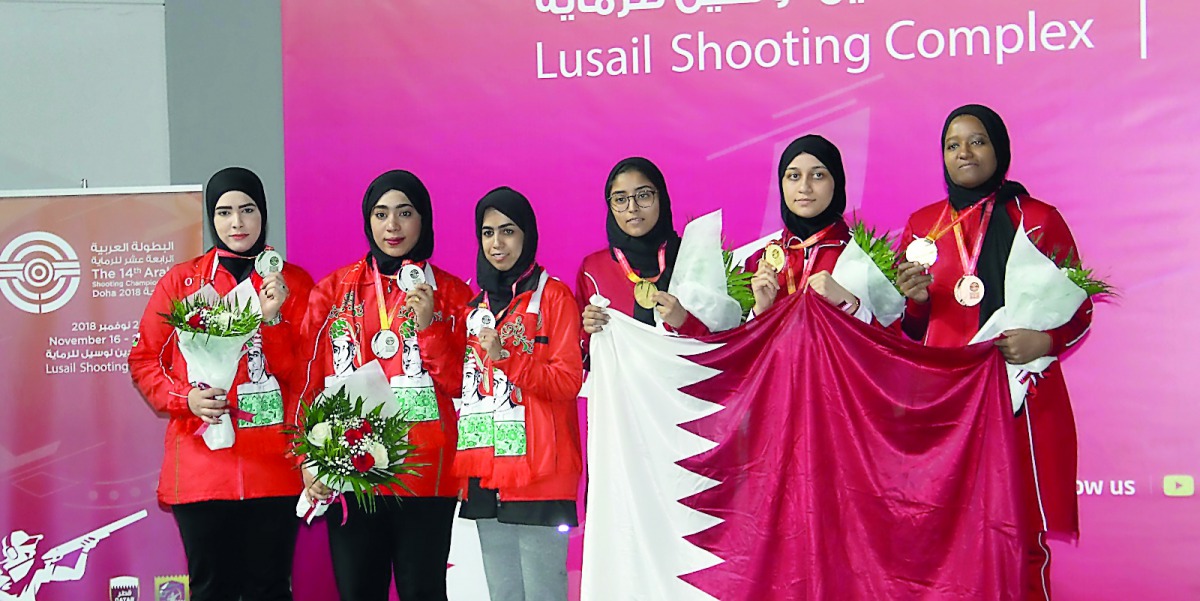 The podium winners at the 14th Arab Championship pose for a picture during the victory ceremony at Losail Shooting Range on Tuesday.