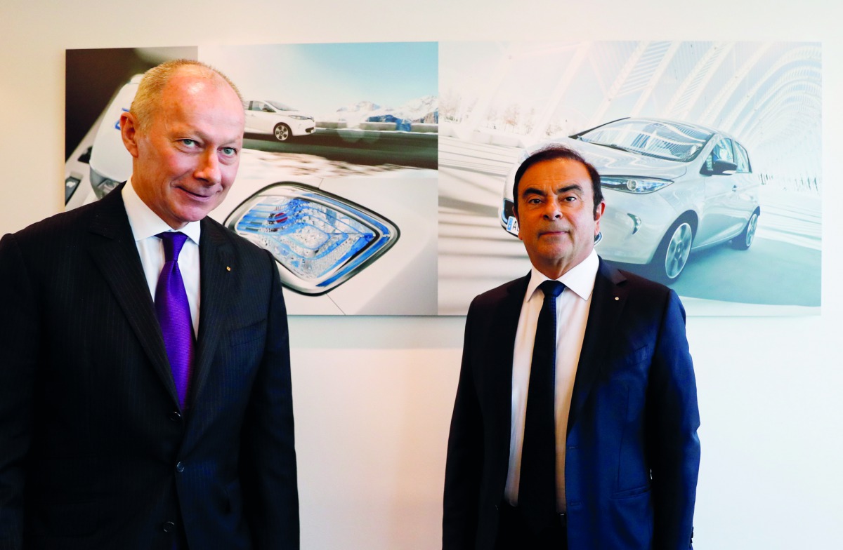Carlos Ghosn (L), Chairman and Chief Executive Officer of Renault, and Thierry Bollore, Renault Chief Operating Officer, attend the French carmaker Renault's 2017 annual results presentation at their headquarters in Boulogne-Billancourt, near Paris, Franc