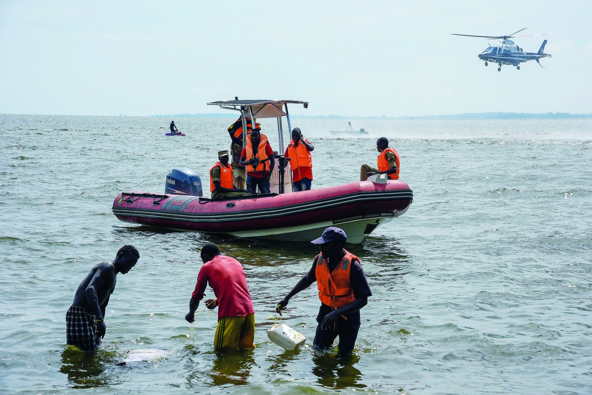 Rescuers search for victims at the site of a capsized cruise boat on Lake Victoria near Mutima village, south of Kampala, Uganda, on November 25, 2018. Thirty people drowned and more than 60 were feared dead after a pleasure boat sank in Lake Victoria, Ug