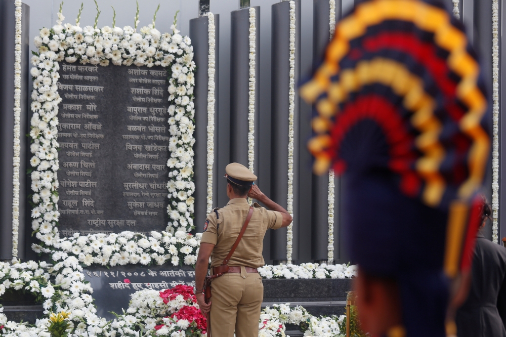 A policeman pays his respects at a memorial to mark the tenth anniversary of the November 26, 2008 attacks, in Mumbai, India, November 26, 2018. REUTERS/Francis Mascarenhas