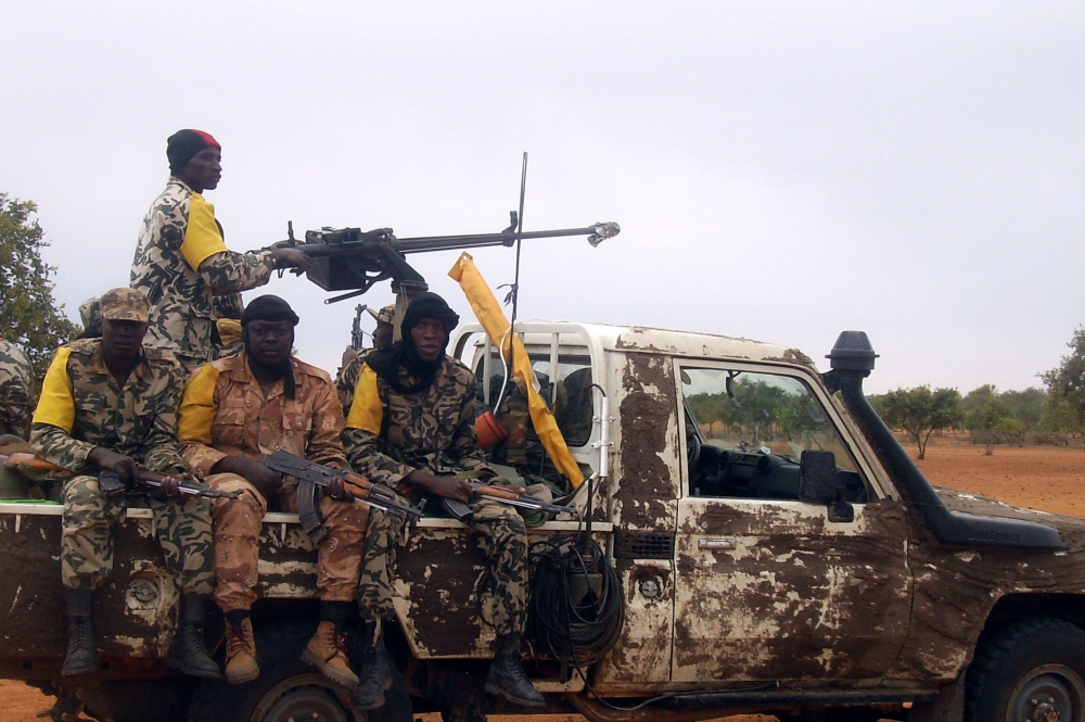 FILE PHOTO:  In this file photo taken on July 18, 2011 Malian troops patrol on a pick-up car, three weeks after a military raid dislodged Al-Qaeda in the Islamic Maghrab (AQIM) from its newly-built base in the Wagoudou forest.  AFP / SERGE DANIEL