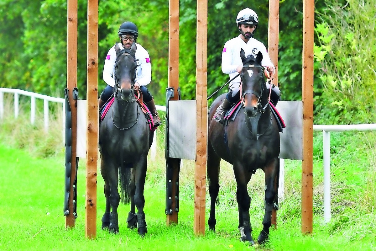 Qatari jockeys Abdulaziz Jaber Dharman and Saleh Salem Al Marri during a training session in this file picture. 