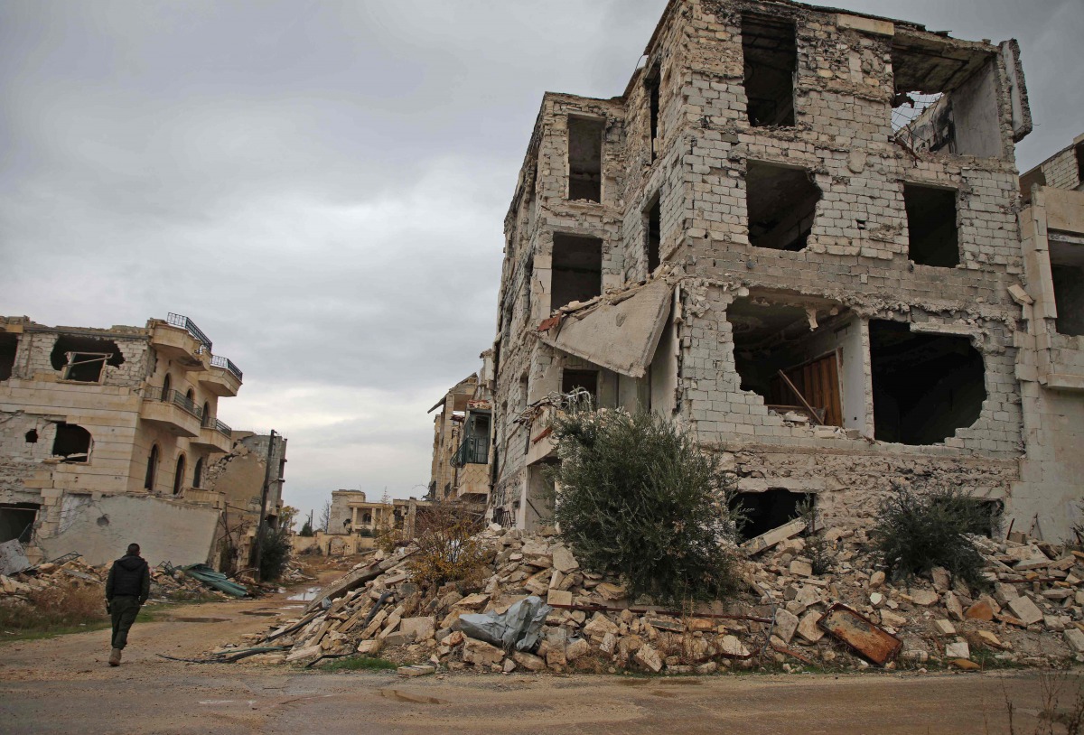 This picture taken on November 26, 2018 shows a damaged building in the Syrian rebel-held al-Rashidin district of western Aleppo's countryside near Idlib province.  AFP / Aaref Watad
