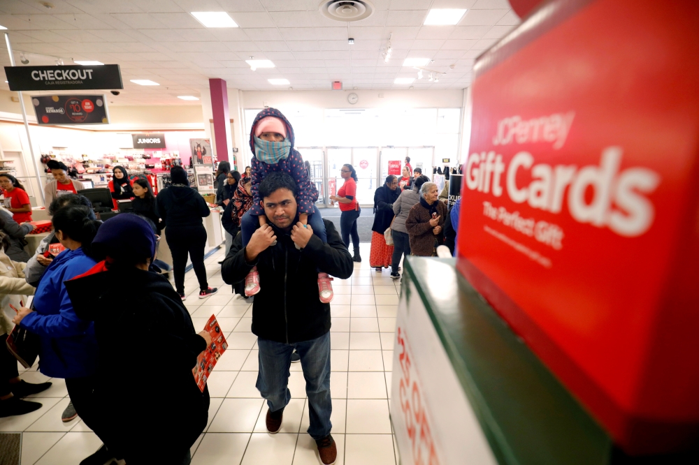 Customers arrive to shop during the Black Friday sales event on Thanksgiving Day at JCPenney in Niles, Illinois,  November 22, 2018. Reuters/John Gress