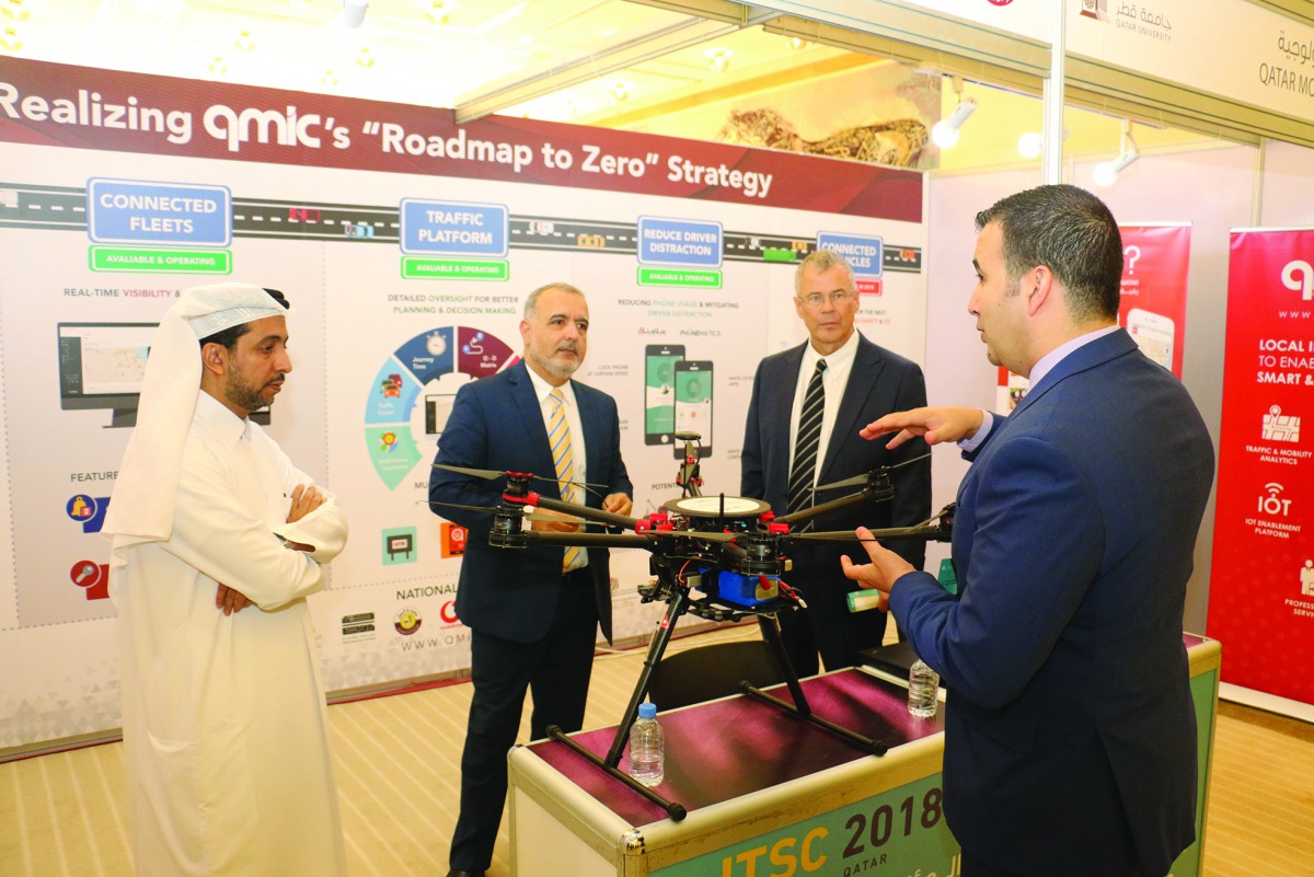 The senior officials of Qatar Mobility Innovations Center (QMIC) briefing about their digital solutions at the International Traffic Safety Conference & Exhibition in Doha.