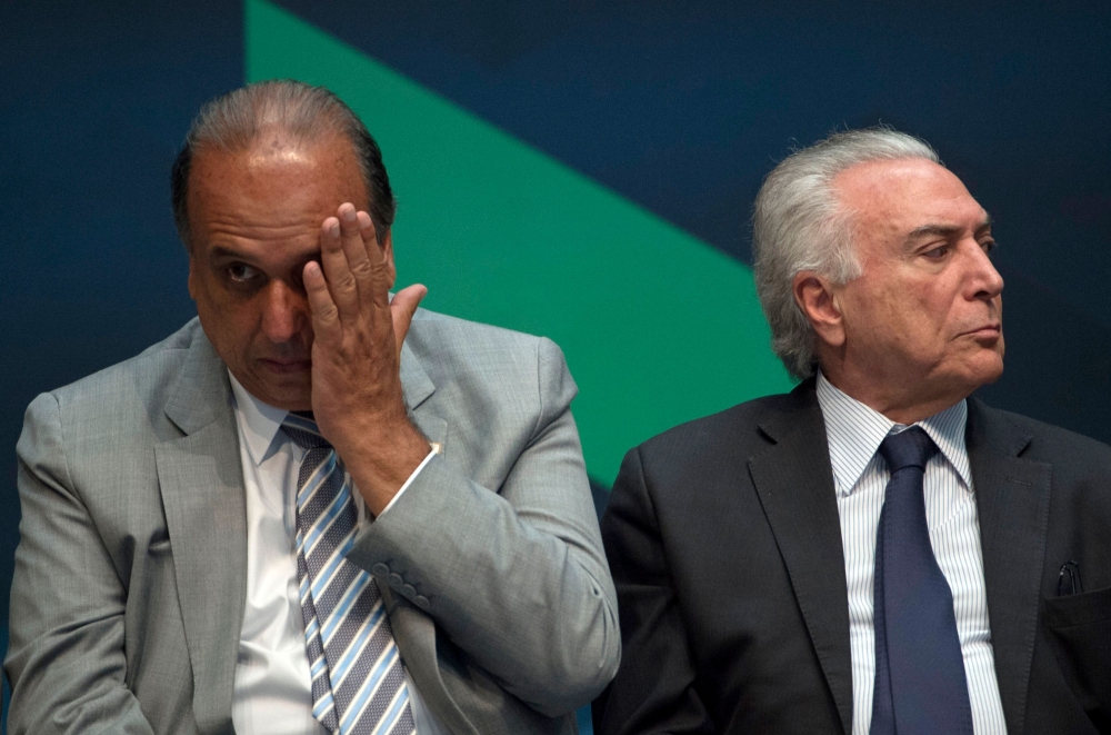 FILE PHOTO: In this file photo taken on February 20, 2018 Brazilian President Michel Temer (R) and Rio de Janeiro's Governor Luiz Fernando Pezao (L) take part in an event announcing the beginning of the final stage of the submarines construction, planned 