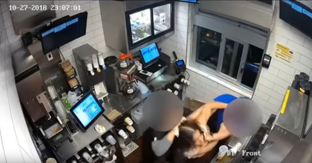 Screengrab of a video shows a suspect choking and pushing the store manager in a McDonald's restaurant in Santa Ana after she became combative when she entered the restaurant from a back door asking for ketchup and was told she could not be in that area o