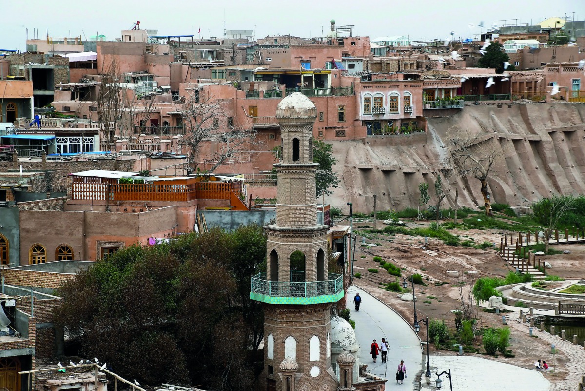 People make their way through the Old City in Kashgar, Xinjiang Uighur Autonomous Region, China September 6, 2018. Picture taken September 6, 2018. Reuters/Thomas Peter
