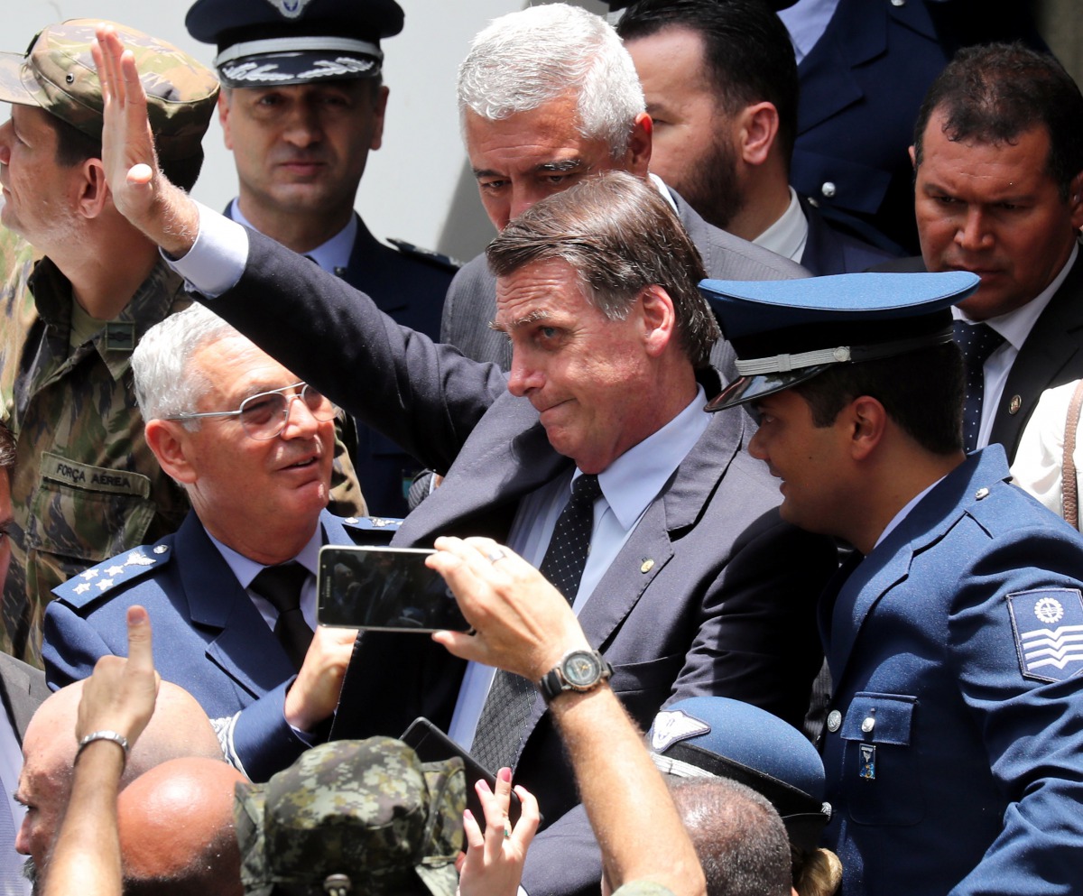 Brazil's President-elect Jair Bolsonaro waves as he attends the graduation of officers of the School of Aeronautical Specialists in Guaratingueta, Brazil November 30, 2018. Reuters/Paulo Whitaker