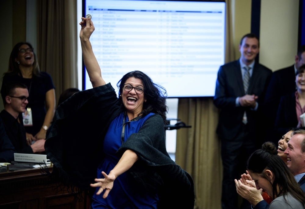 US Representative-elect Rashida Tlaib (D-MI) reacts to a good number during an office lottery for new members of Congress on Capitol Hill November 30, 2018 in Washington, DC. AFP / Brendan Smialowski 
