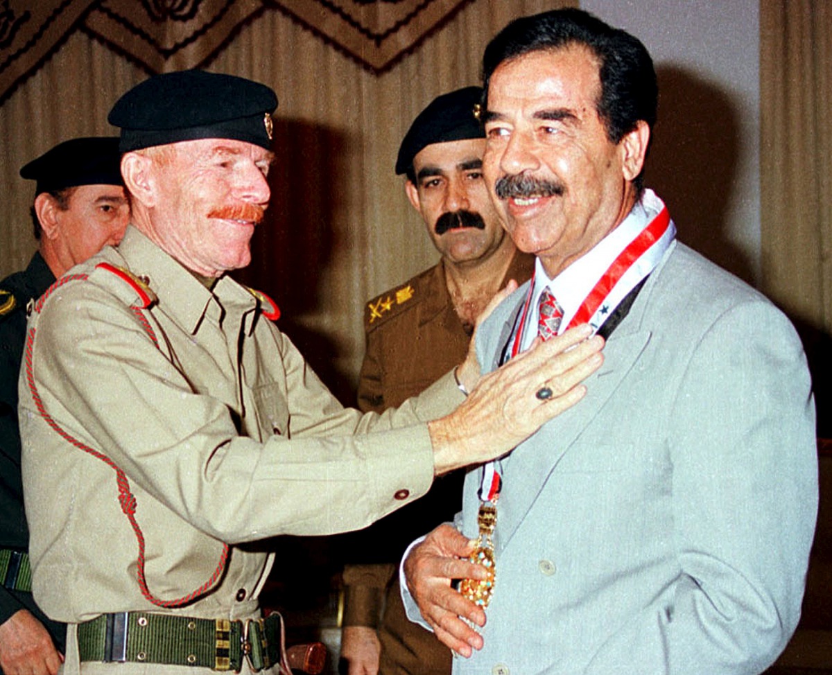 Former Iraqi President Saddam Hussein is seen with aide Ezzat al-Douri in this undated Reuters file photo