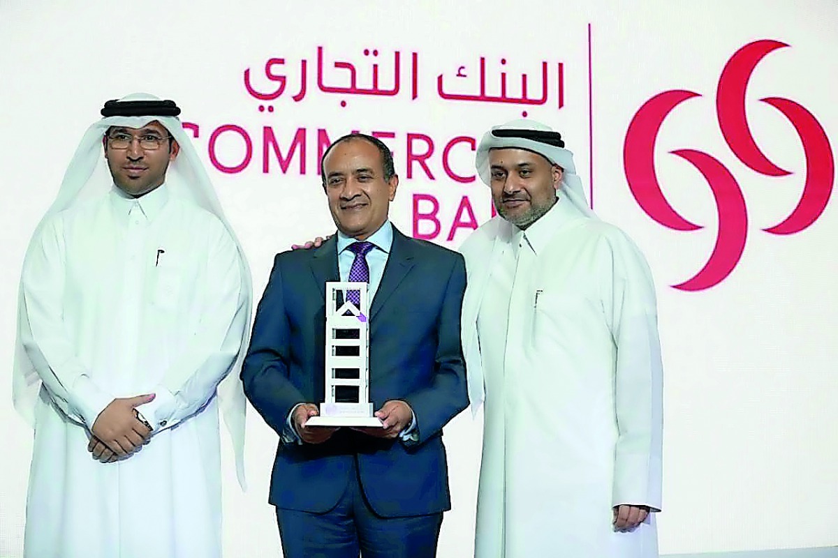 Joseph Abraham (centre), Group Chief Executive Officer, Commercial Bank; with Yousuf Mohamed Al Jaida (right), Chief Executive Officer, QFC Authority; and Hamed Al Saadi, Chief Financial and Tax Officer, QFC Authority, during the award ceremony at Four Se
