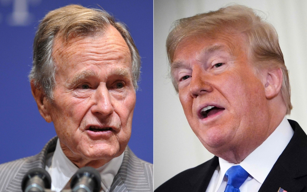 This combination of file pictures created on December 01, 2018 shows, former president George H.W. Bush (L) on October 16, 2009, in College Station, Texas; and President Donald Trump on November 7, 2018, in Washington, DC.  AFP / Mandel Ngan 