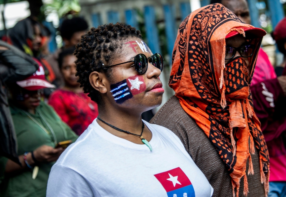 Papuans take part on a parade in Surabaya, East Java province, on December 1, 2018, during a commemoration of the independence day of Papua from Dutch colonial, which is then commemorated every year by separatists as a symbol of their freedom from Indones