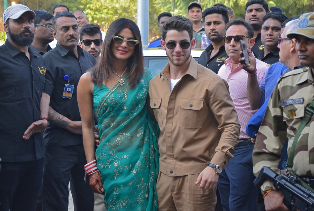 Bollywood actress Priyanka Chopra and her husband singer Nick Jonas pose outside the airport in Jodhpur in the desert state of Rajasthan, India, December 3, 2018. REUTERS/Stringer
 