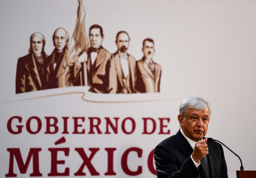 Mexico's President Andres Manuel Lopez Obrador delivers a speech before relatives of 43 missing students, at the National Palace in Mexico City on December 3, 2018.  AFP / Ronaldo Schemidt
 