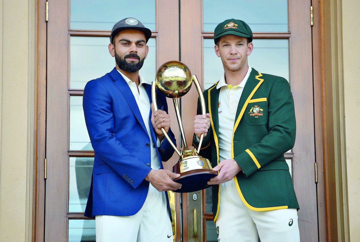 Australia cricket captain Tim Paine (R) and India cricket captain Virat Kohli (L) pose with the Border Gavaskar trophy ahead of the first Test at the Adelaide Oval in Adelaide on December 5, 2018. AFP / Peter Parks