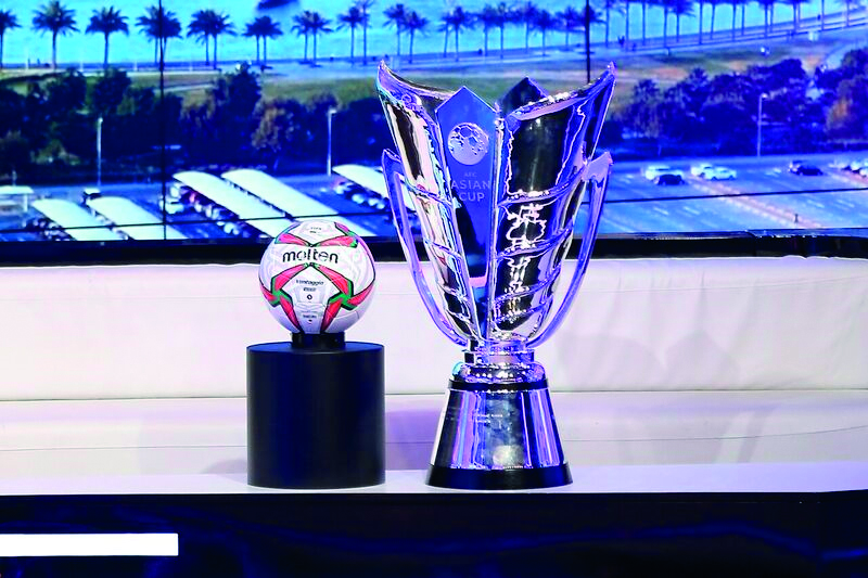 The AFC Asian Cup trophy and the official ball, on display  at the beIN SPORT studio complex yesterday. 