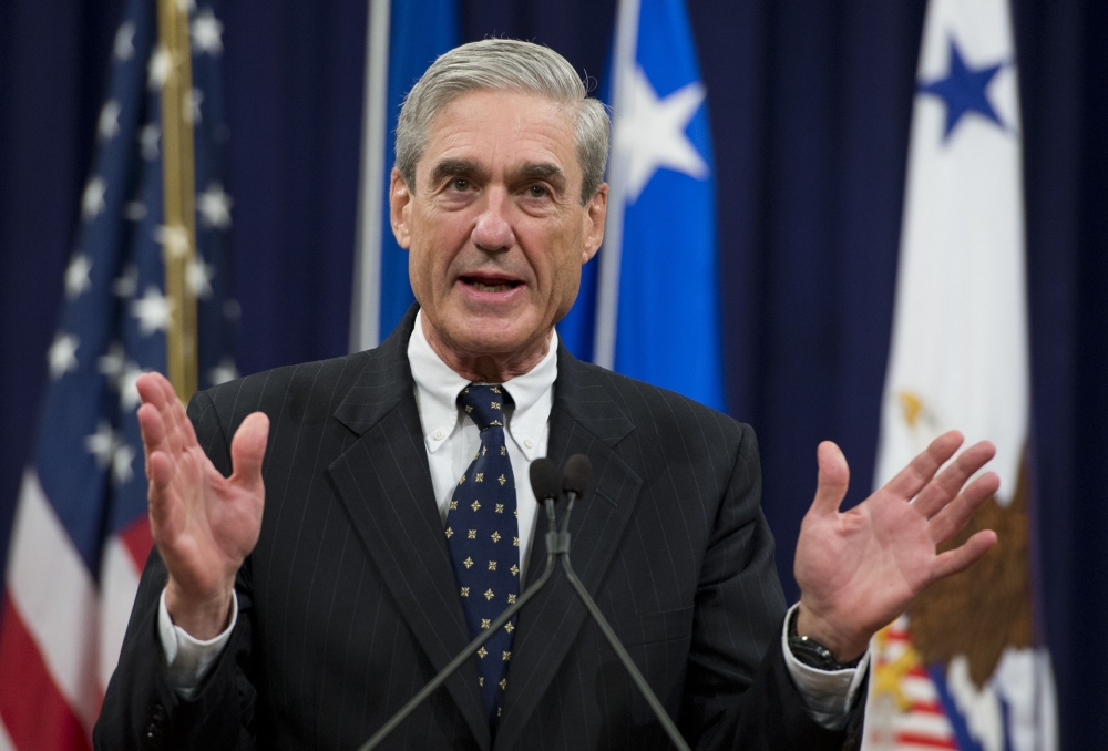 In this file photo taken on August 1, 2013, former Federal Bureau of Investigation (FBI) Director Robert Mueller speaks during a farewell ceremony in Mueller's honor at the Department of Justice. / AFP / Saul LOEB 