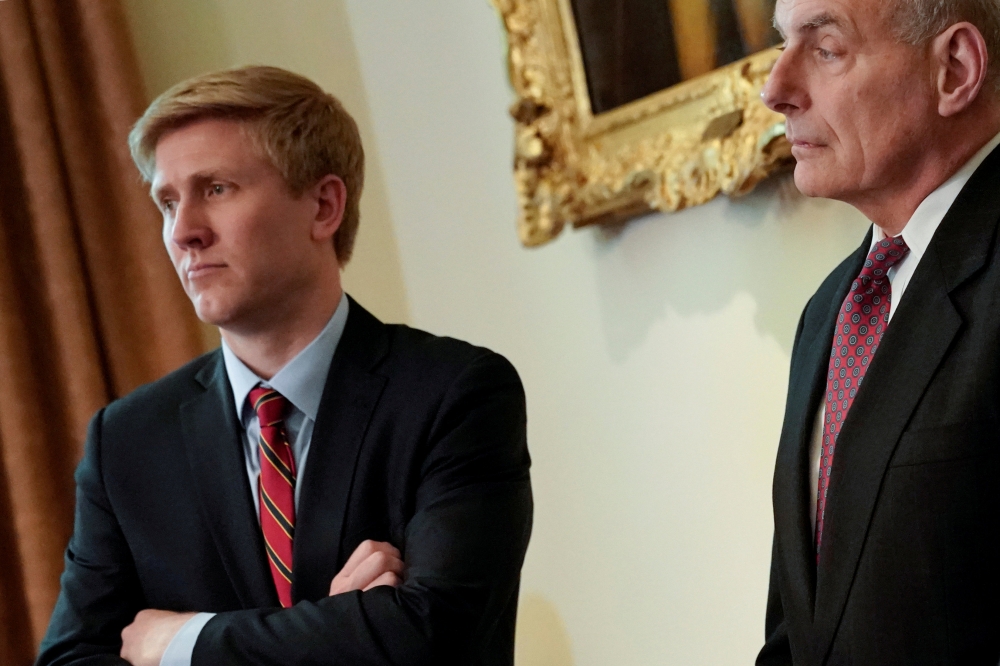 FILE PHOTO: Nick Ayers (L), chief of staff to U.S. Vice President Mike Pence, and White House Chief of Staff John Kelly look on as U.S. President Donald Trump holds a cabinet meeting at the White House in Washington, U.S. May 9, 2018. Picture taken May 9,