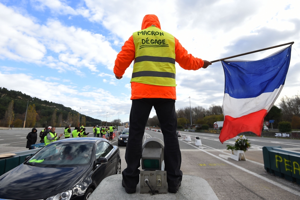 A man with a sign reading 