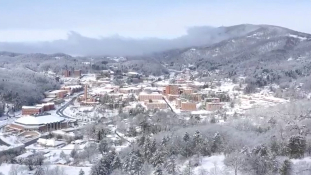 An aerial view shows snow over the Appalachian State University in Boone, North Carolina, U.S., December 10, 2018, in this still image taken from a social media video. Nelson Aerial Productions/via Reuters