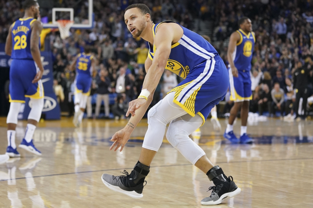 Golden State Warriors guard Stephen Curry (30) celebrates after making a three-point basket against the Minnesota Timberwolves during the fourth quarter at Oracle Arena. Credit: Kyle Terada-USA TODAY Sports
 