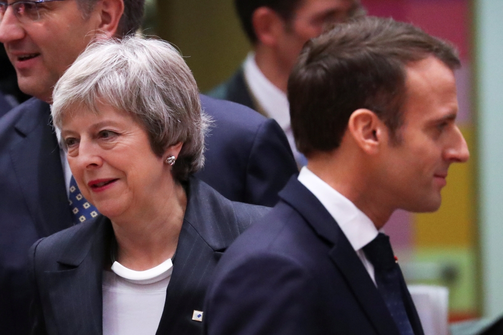 Britain's Prime Minister Theresa May and French President Emmanuel Macron take part in a European Union leaders summit in Brussels, Belgium December 13, 2018. Reuters/Yves Herman