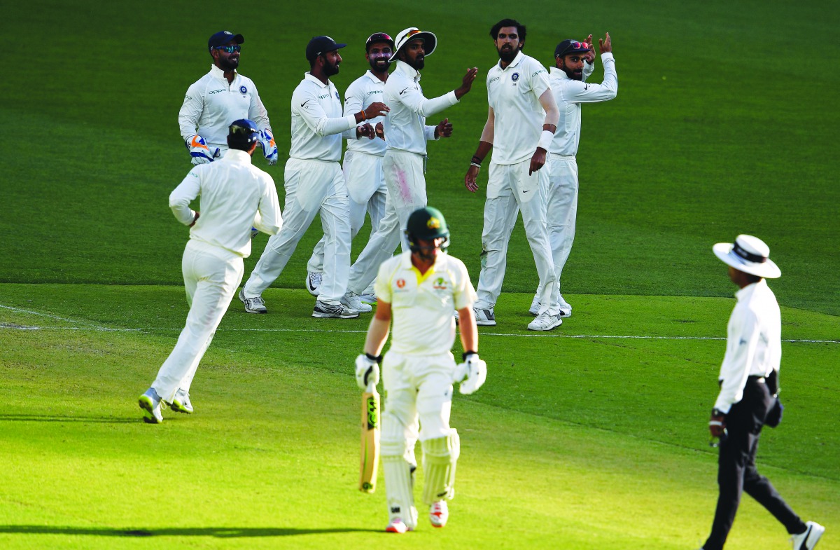 India's paceman Ishant Sharma (2nd R) celebrates with teammates the dismissal of Australia's batsman Peter Handscomb during day one of the second Test cricket match between Australia and India in Perth on December 14, 2018. AFP / William West 