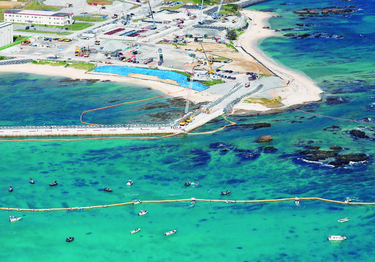 This aerial view shows land reclamation work on the Henoko coastal district of Nago, Okinawa prefecture, on December 14, 2018, to build a new site for relocating a US military airbase.  AFP / Jiji Press