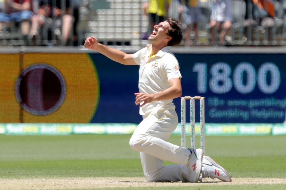 Australia's Pat Cummins celebrates after bowling and catching out India's Jasprit Bumrah to win the match on day five of the second test between Australia and India at Perth Stadium in Perth, Australia, December 18, 2018. AAP/Richard Wainwright/via Reuter