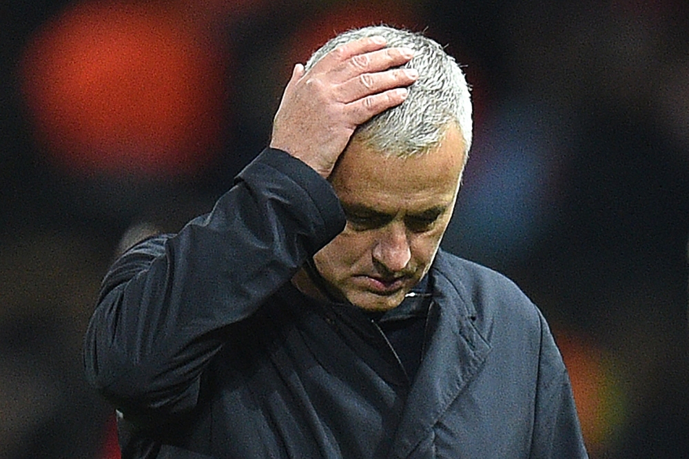 In this file photo taken on November 27, 2018 Manchester United's Portuguese manager Jose Mourinho leaves the pitch following the UEFA Champions League group H football match between Manchester United and Young Boys at Old Trafford in Manchester, north-we