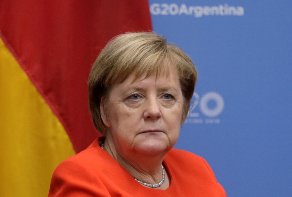 :FILE PHOTO: German Chancellor Angela Merkel attends a meeting with U.S. President Donald Trump during the G20 leaders summit in Buenos Aires, Argentina December 1, 2018. REUTERS/Luisa Gonzalez