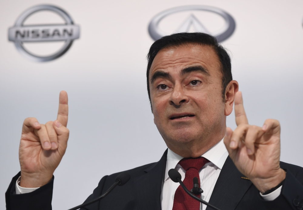  In this file photo taken on May 13, 2015, Nissan Motors Chairman and CEO Carlos Ghosn speaks during the company's financial results press conference in Yokohama. / AFP / Toshifumi KITAMURA 