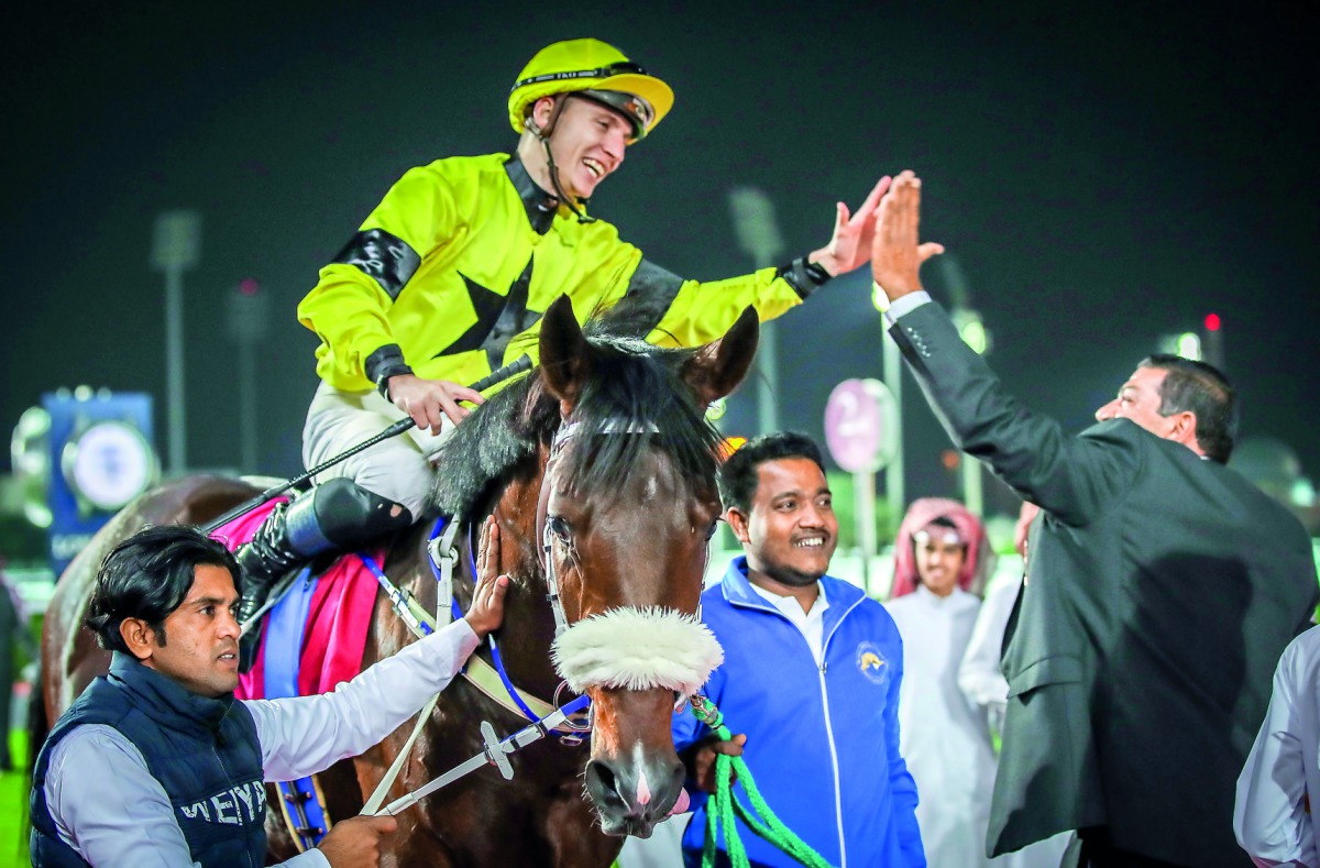 Ryan Curatolo, astride Full Moon, celebrates after his victory.