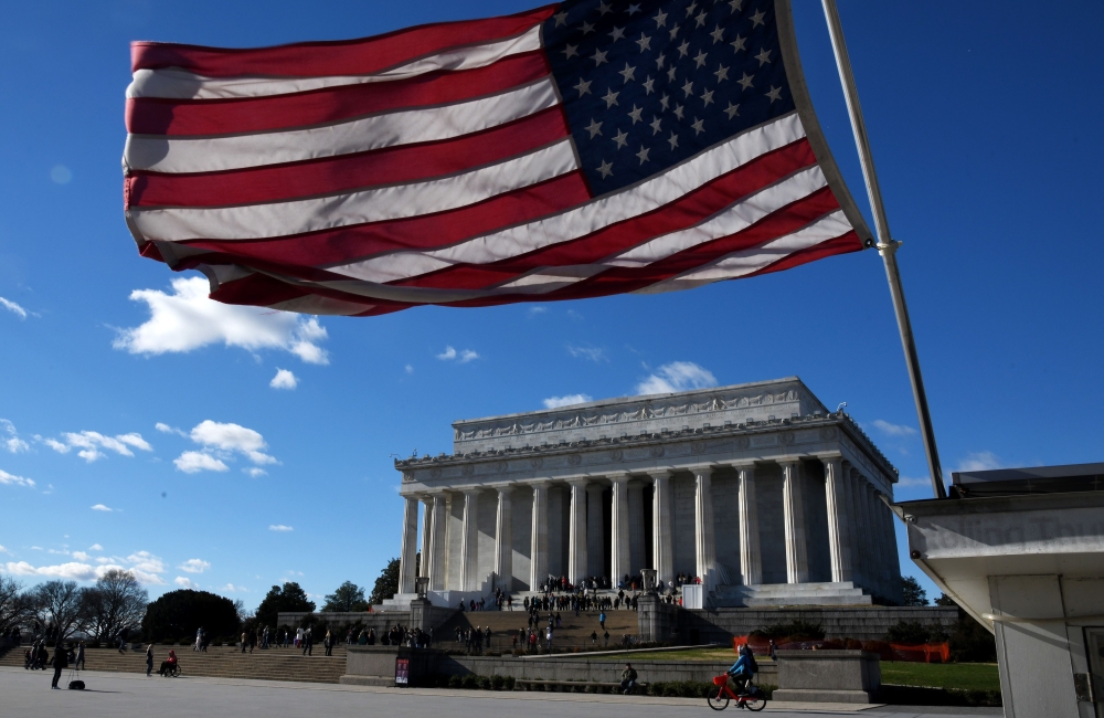 An American flag flies near the Lincoln Memorial on December 22, 2018 in Washington, DC. Olivier Douliery/Getty Images/AFP
