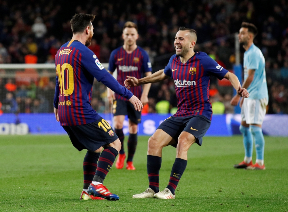  Barcelona's Lionel Messi celebrates scoring their second goal with Jordi Alba REUTERS/Albert Gea