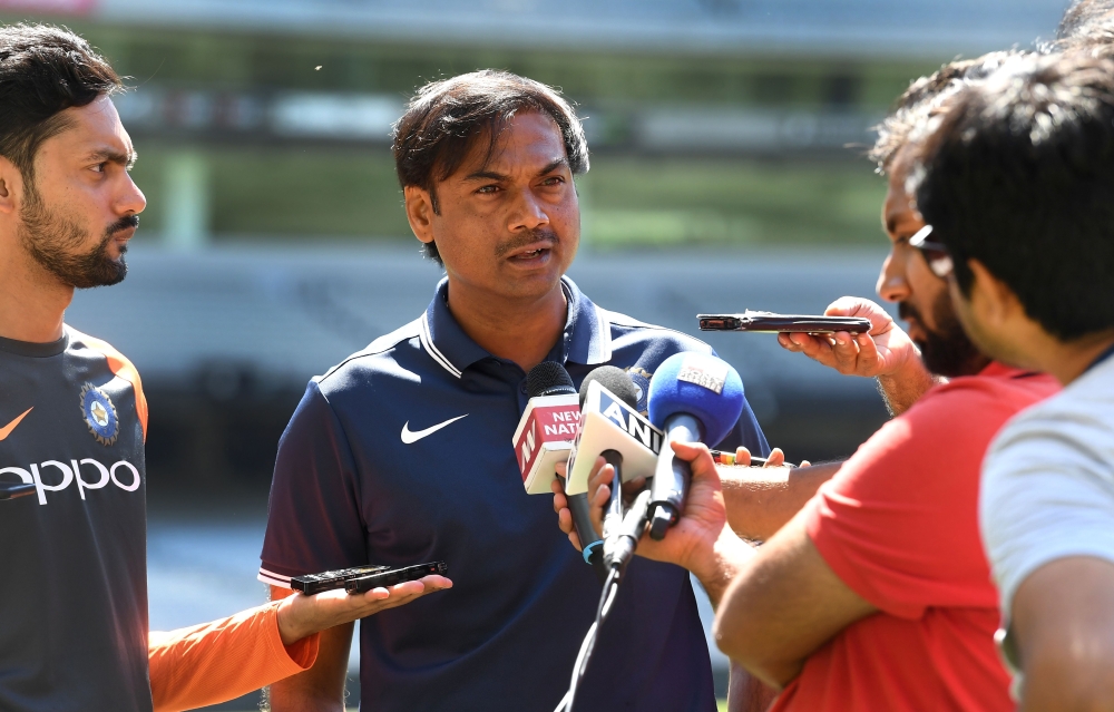India's chairman of the selectors MSK Prasad (C) speaks to the media after a training session in Melbourne on December 25, 2018, ahead of the third cricket Test match between Australia and India. AFP / William West 
