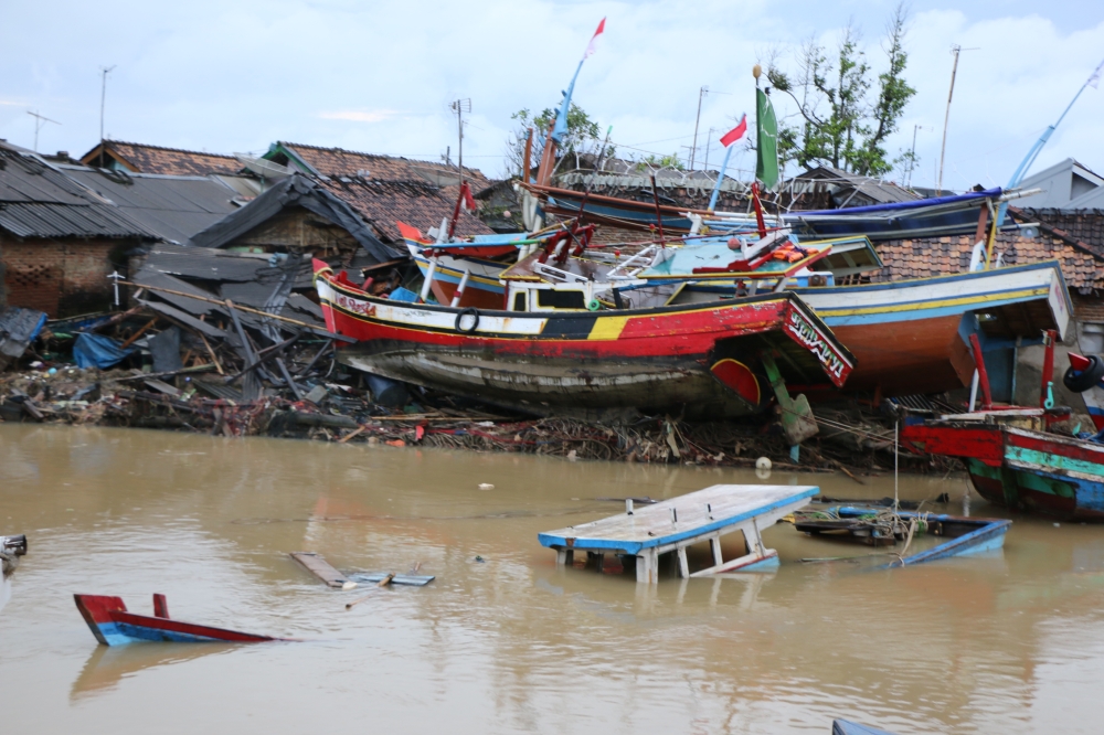Traditional fishing boats are seen damaged after being hit by a tsunami in Banten, Indonesia on December 26, 2018. Fishery industry was damaged by the Tsunami disaster as fishers can not conduct and fishing activities.  Mahmut Atanur - Anadolu 